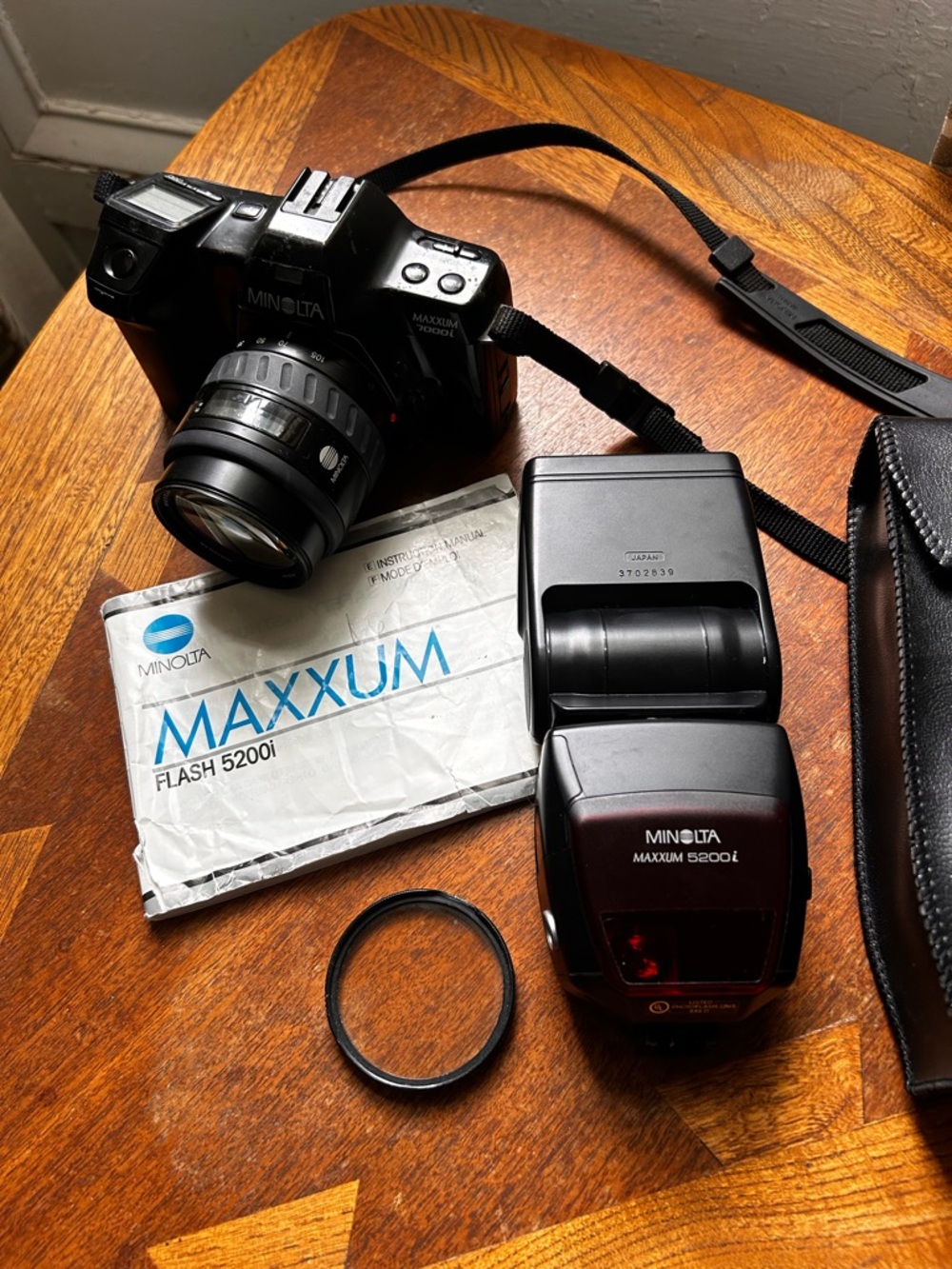 Minolta 7000i 35mm autofocus SLR camera with Maxxum Flash 5200i and flash case.